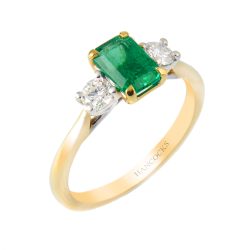 emerald and diamond three stone ring