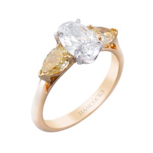 oval diamond and yellow diamond 3-stone ring