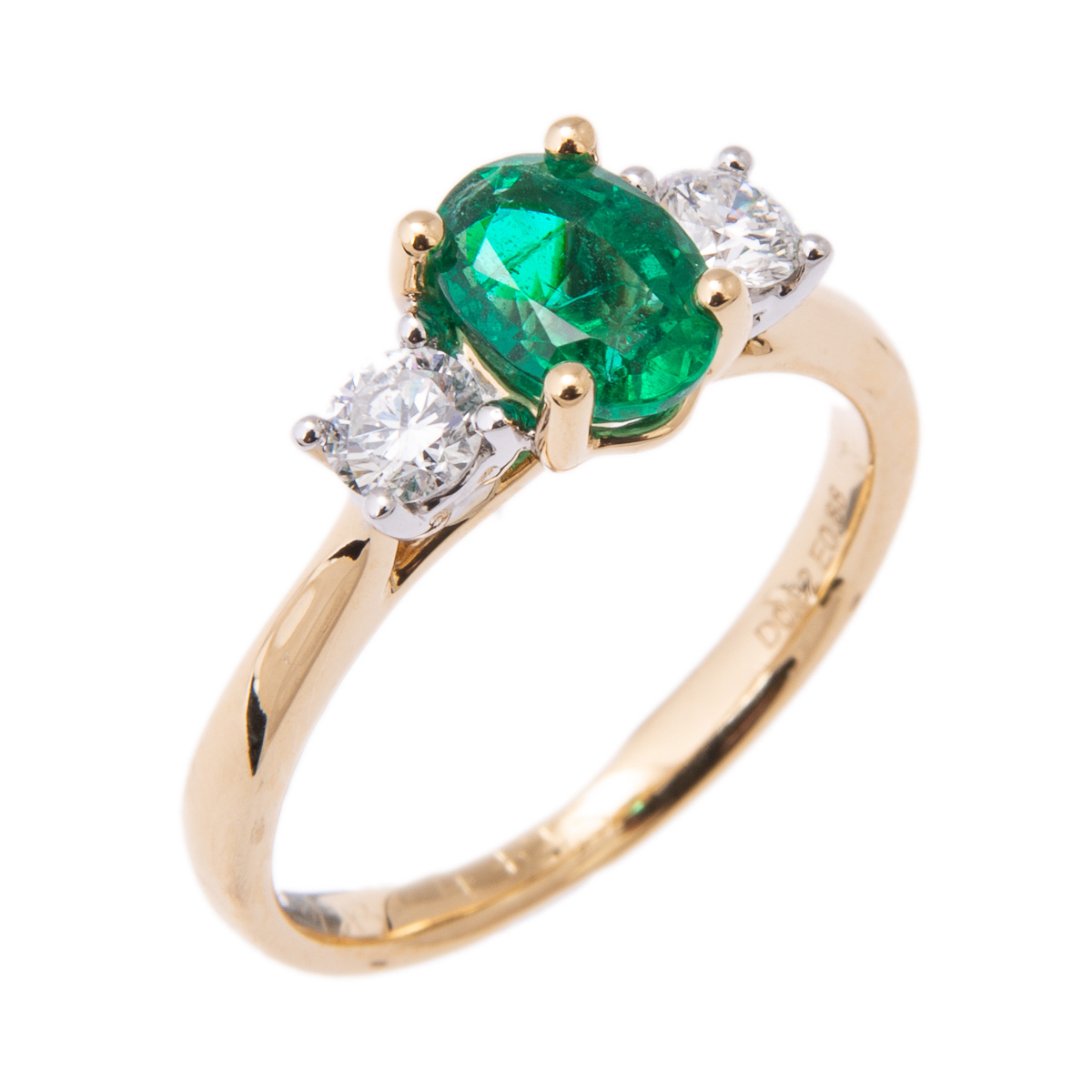 oval emerald and diamond three stone ring