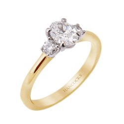 yellow gold oval diamond three stone ring