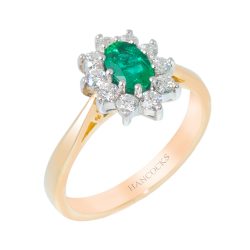 oval emerald and diamond cluster ring