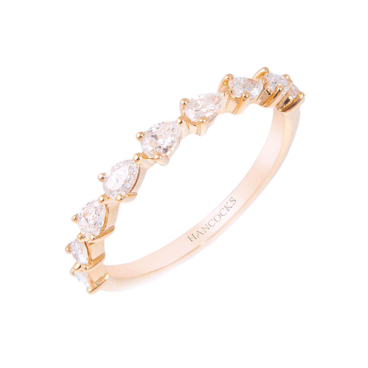 yellow gold pear cut diamond set wedding ring