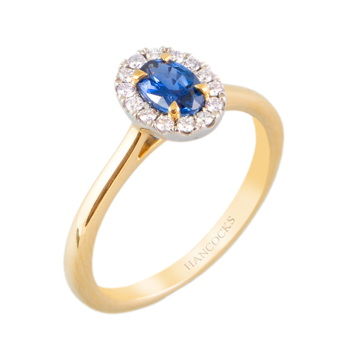 Yellow gold halo cluster sapphire and diamond ring
