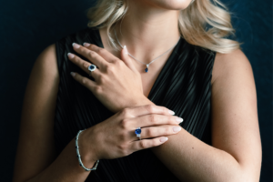 Sapphire and Diamond Rings posed with two hands crossing each other