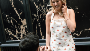 Man proposing with an engagement ring to a woman
