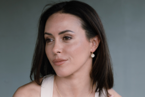 woman wearing daisy earrings