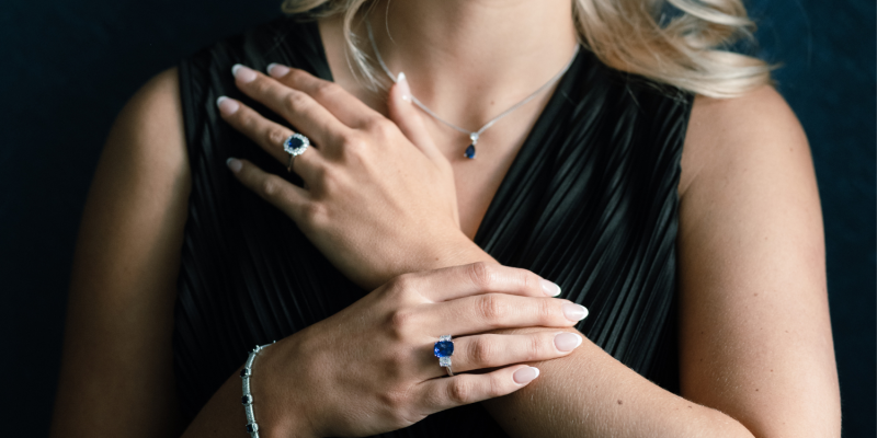 Sapphire and Diamond Rings posed with two hands crossing each other